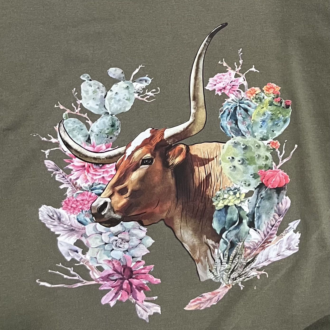 T-shirt with a bull and floral design on a dark background